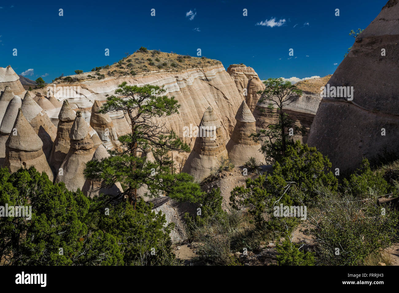 Landscape of cliffs and canyons viewed from the Slot Canyon Trail at Kasha-Katuwe Tent Rocks National Monument, New Mexico, USA Stock Photo