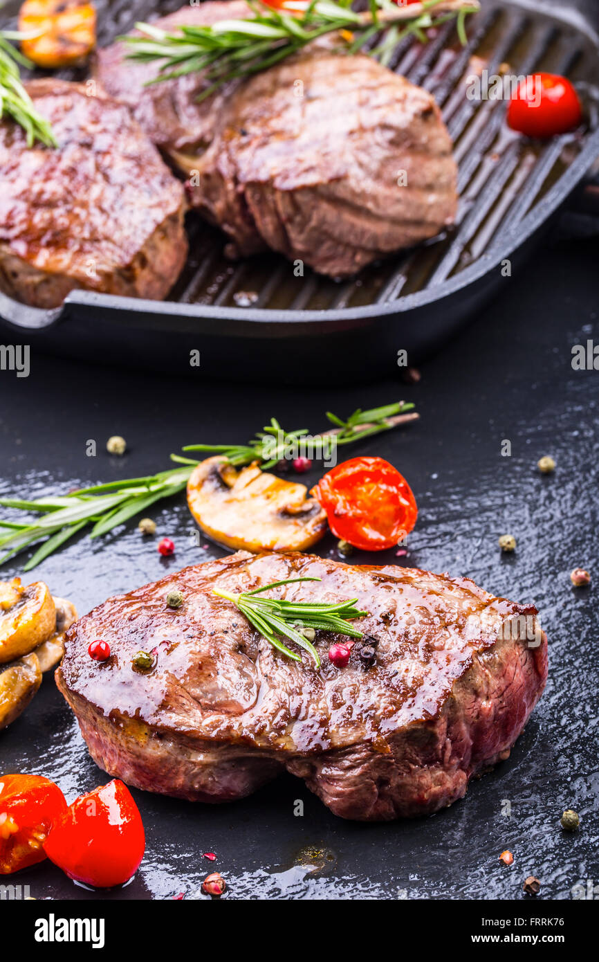 Steak. Grill beef steak. Portions thick beef juicy sirloin steaks on grill teflon pan or granite