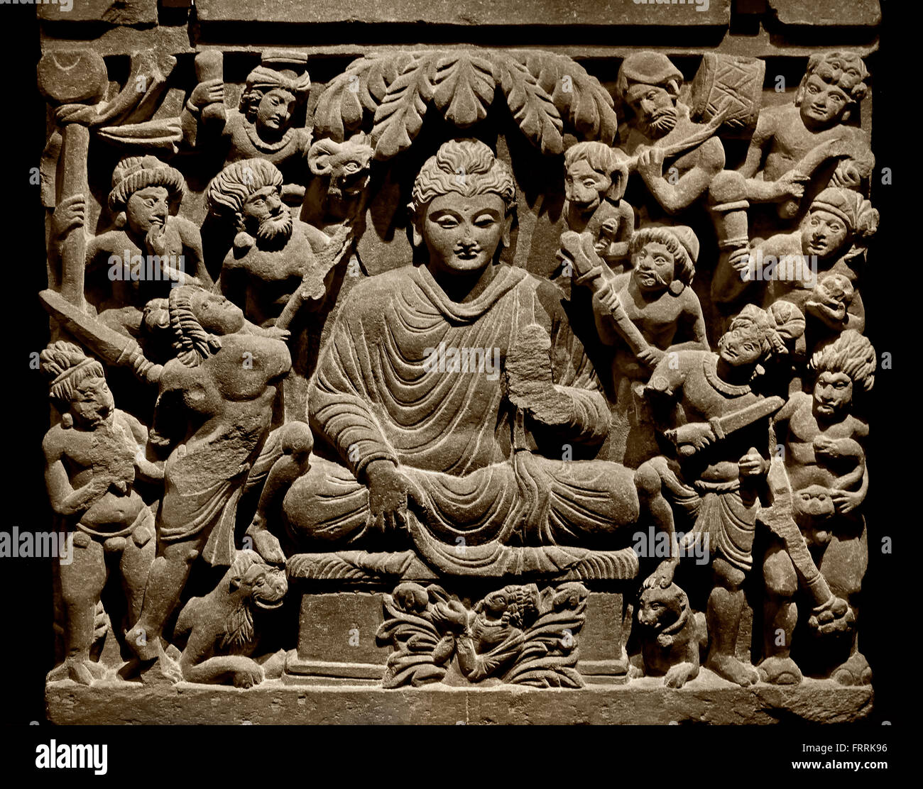 Victory on Mara in Bodhgaya  2 - 3 th Century  Northwestern Pakistan, Schist, Gandhara ( Seated beneath the Bodhi tree he defeats eval and becomes ' awakened ' he is now the Buddha ) Stock Photo