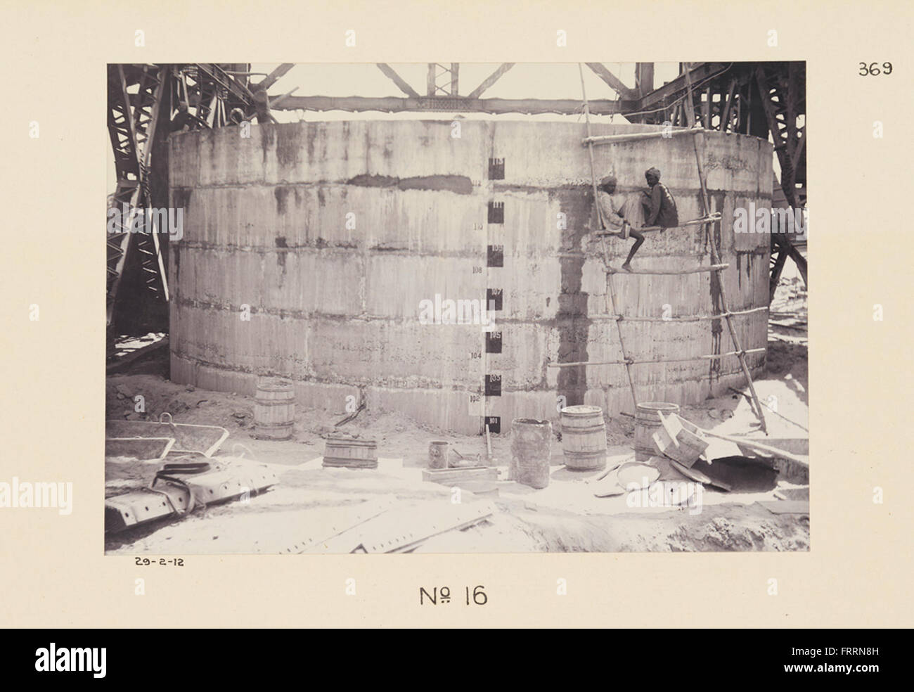 A photograph showing the construction of a railroad bridge, identified ...