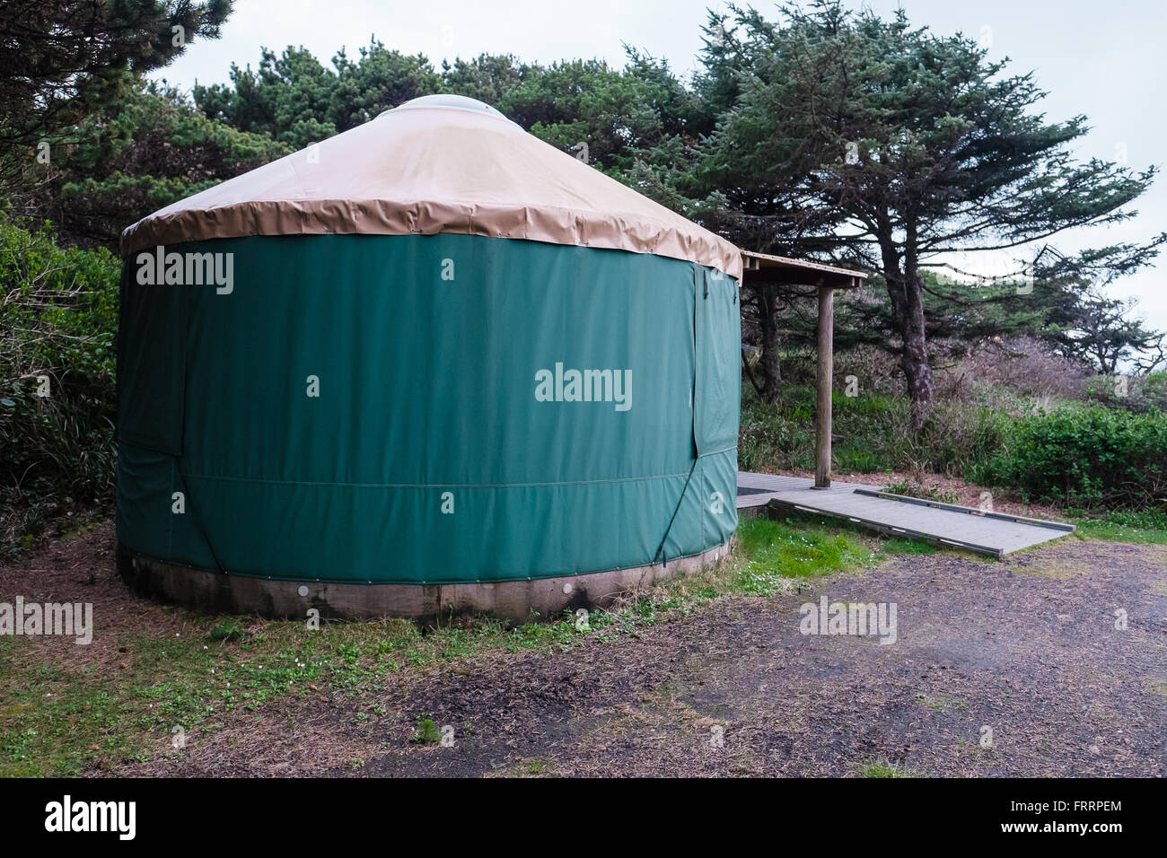 Green camping (or glamping) yurt on the Oregon Coast at a beach campground. Stock Photo