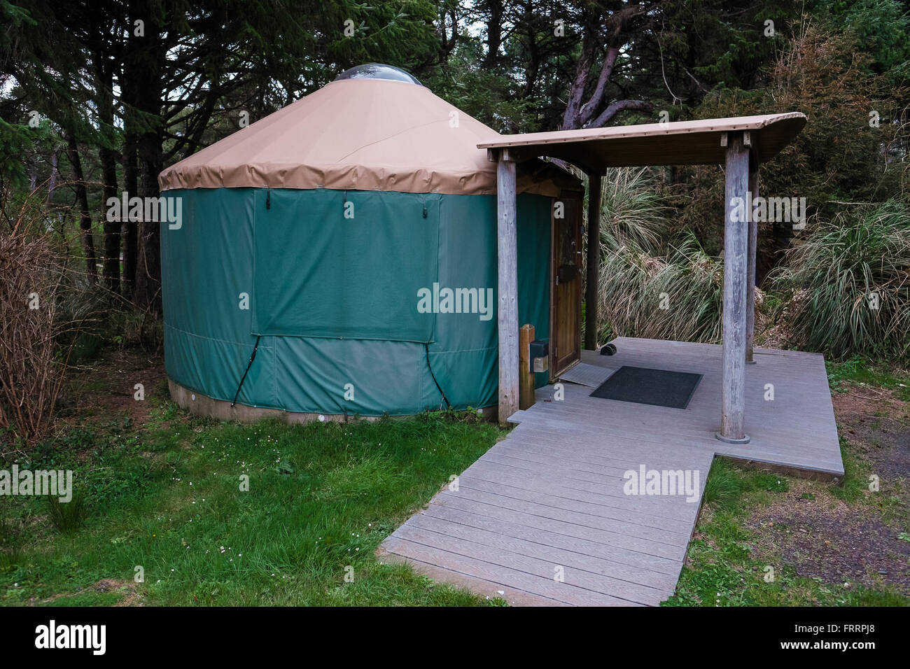 Green camping (or glamping) yurt on the Oregon Coast at a beach campground. Stock Photo