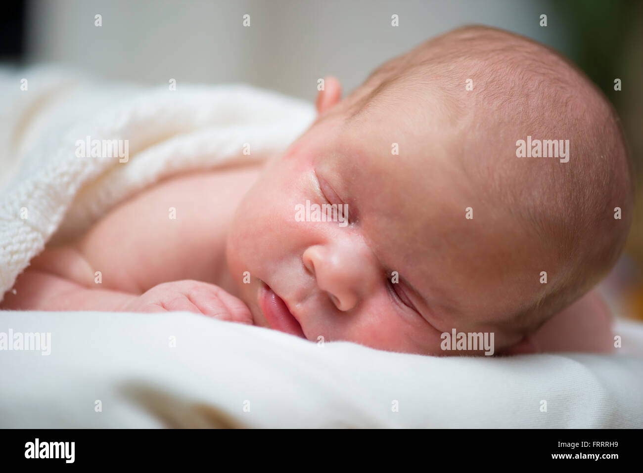 Adorable beautiful newborn baby girl. Maternity and newborn concept. Newborn baby is sleeping Stock Photo