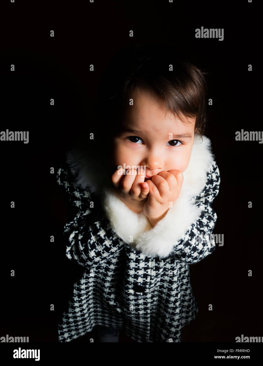 little girl is afraid in darkness Stock Photo