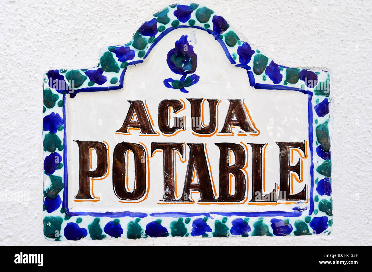 Traditional decorative glazed ceramic agua potable sign. Drinking water sign Stock Photo