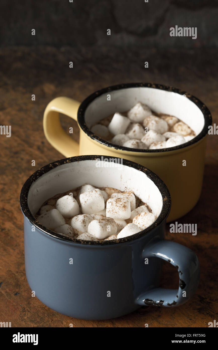 Cups of cocoa with marshmallows on the stone table vertical Stock Photo