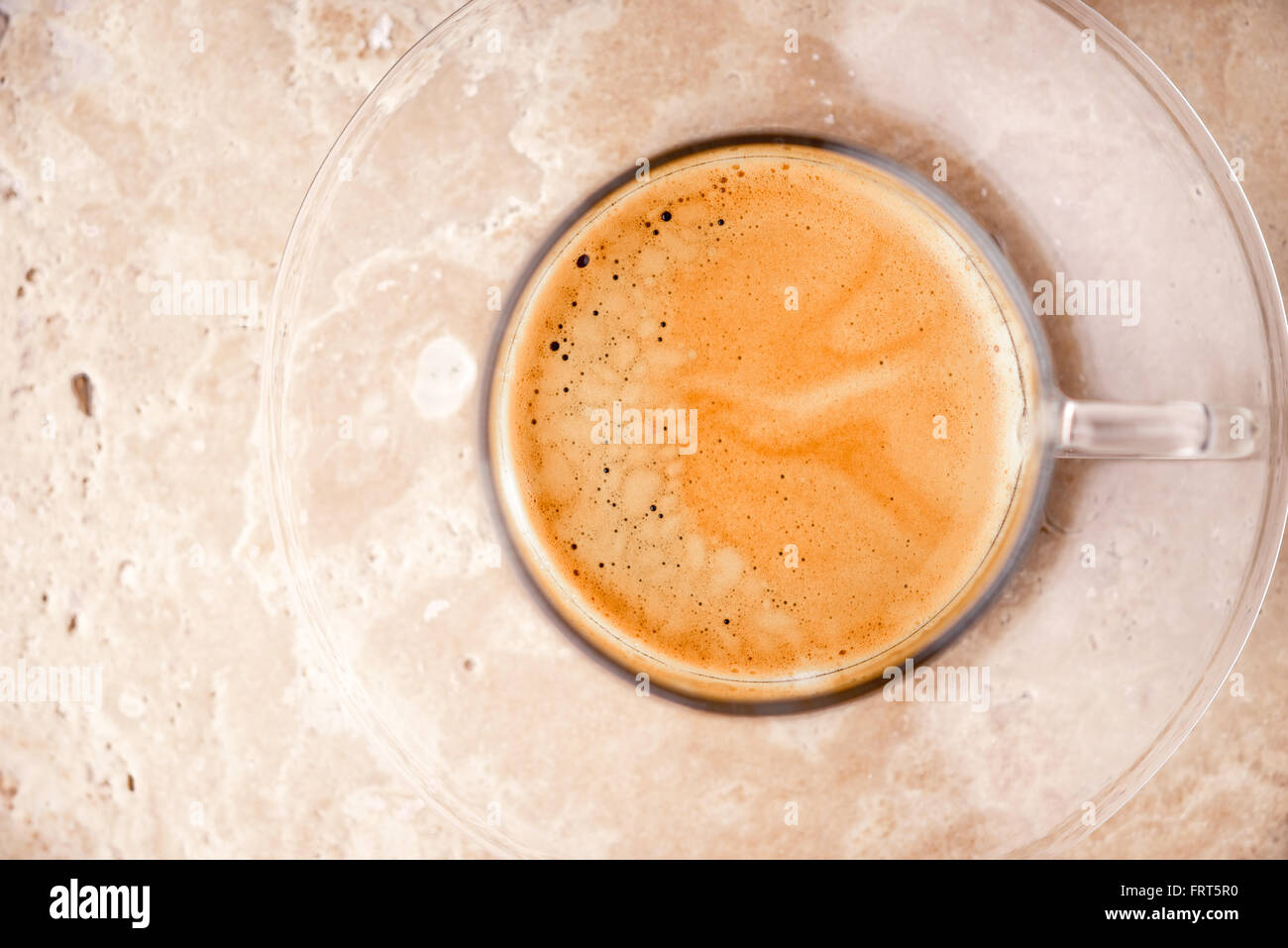Cup of coffee on the stone table top view Stock Photo