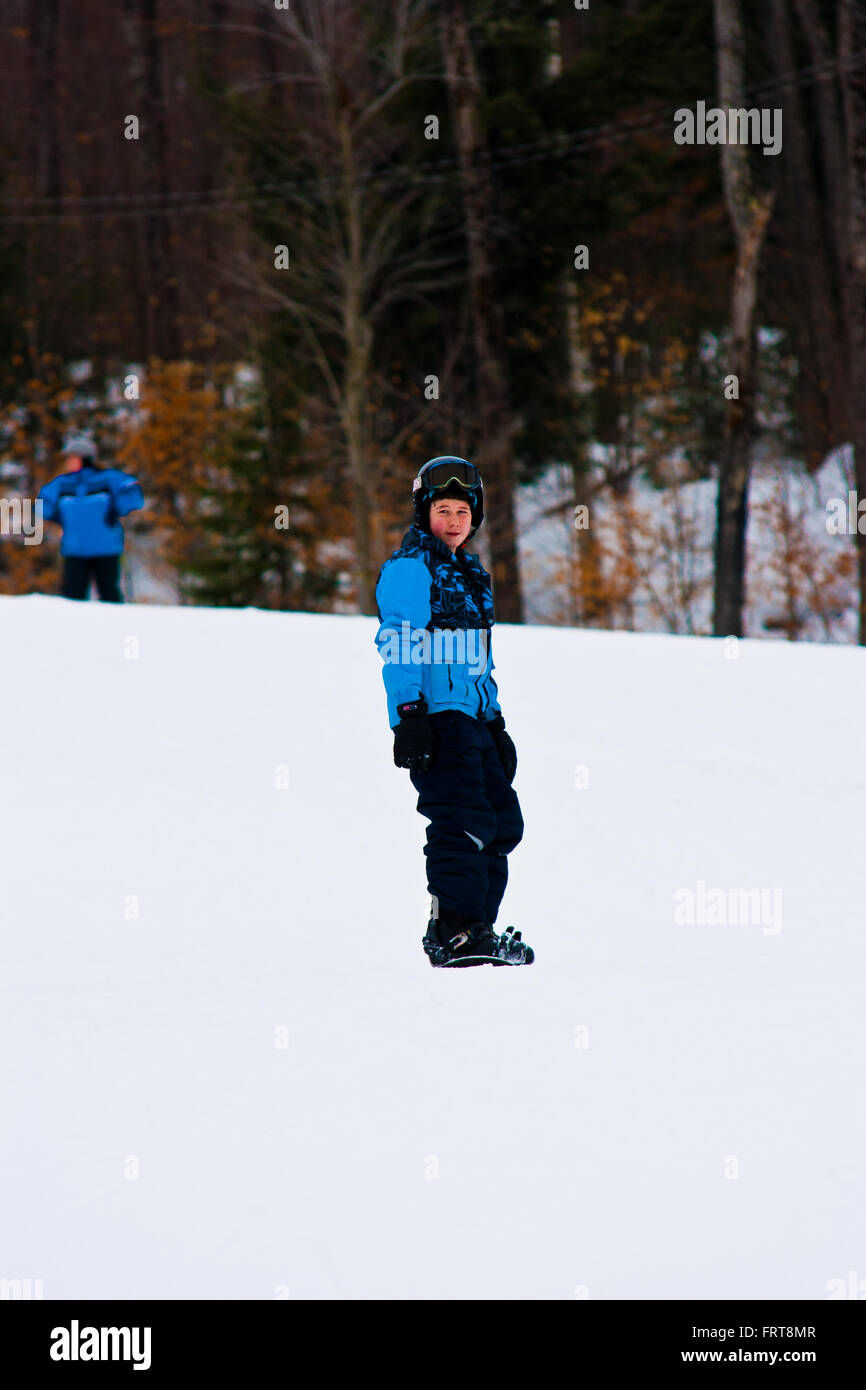 Young male snowboarding. Stock Photo