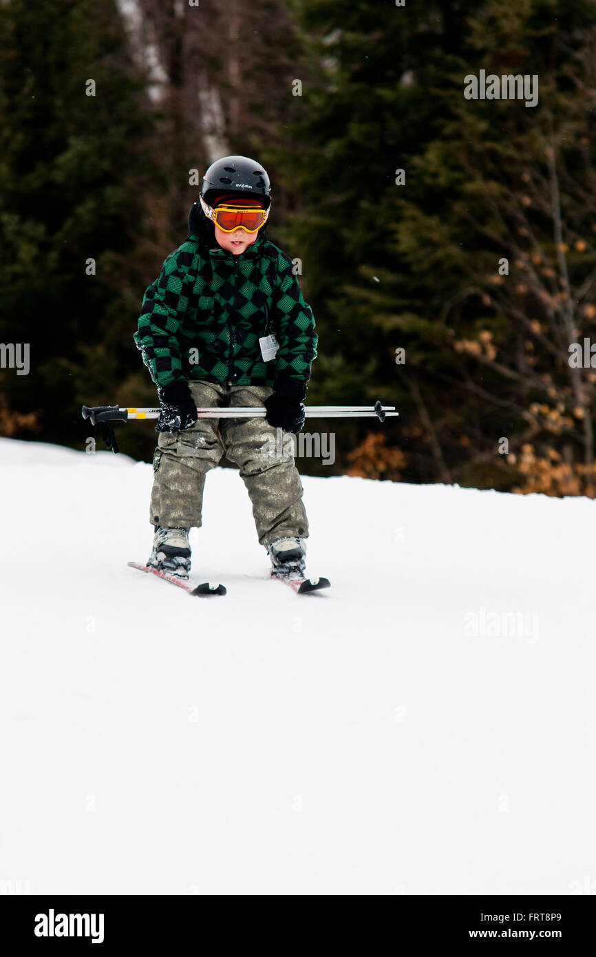 Male teen downhill skiing. Stock Photo
