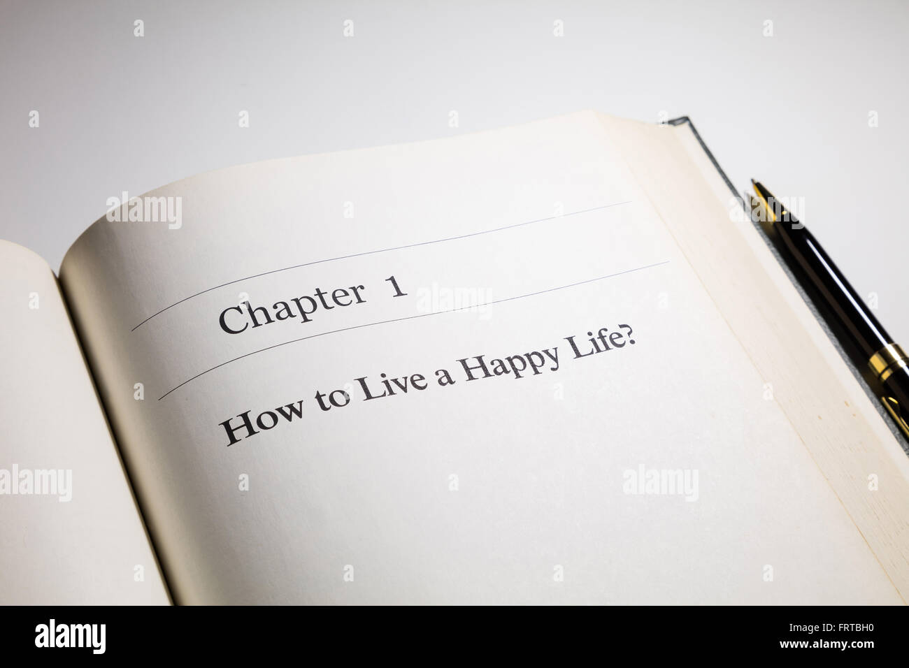 how to live a happy life?  life  philosophy, fake book. Stock Photo
