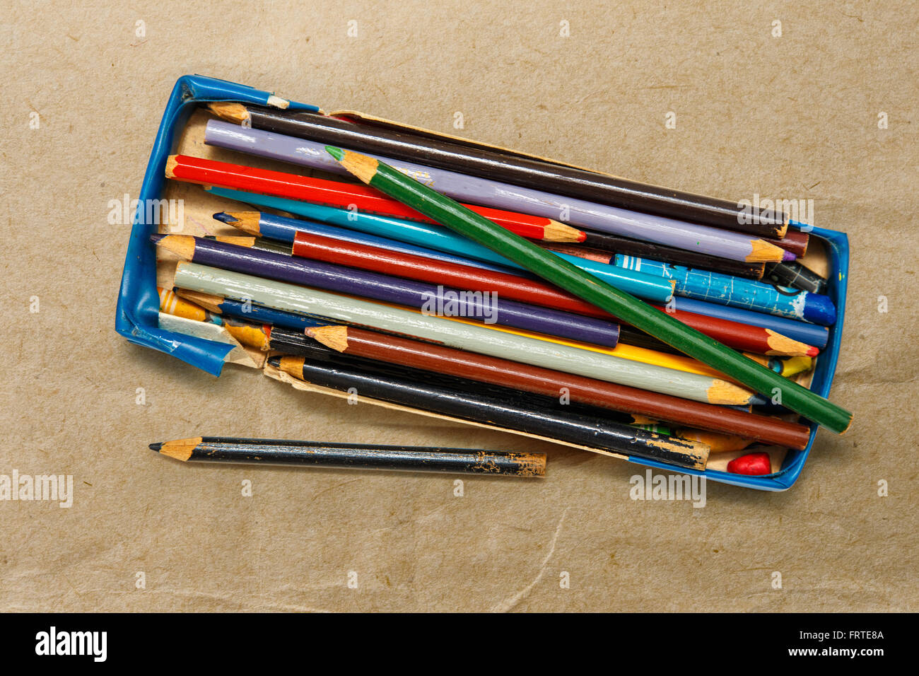 Color pencils in a box on paper background Stock Photo Alamy