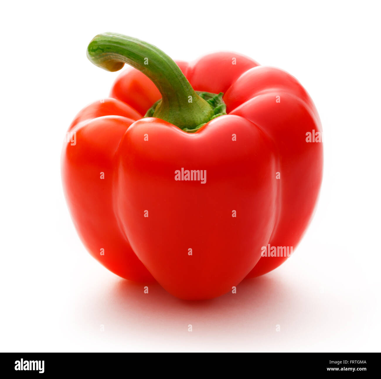 Single red paprika on the white background Stock Photo