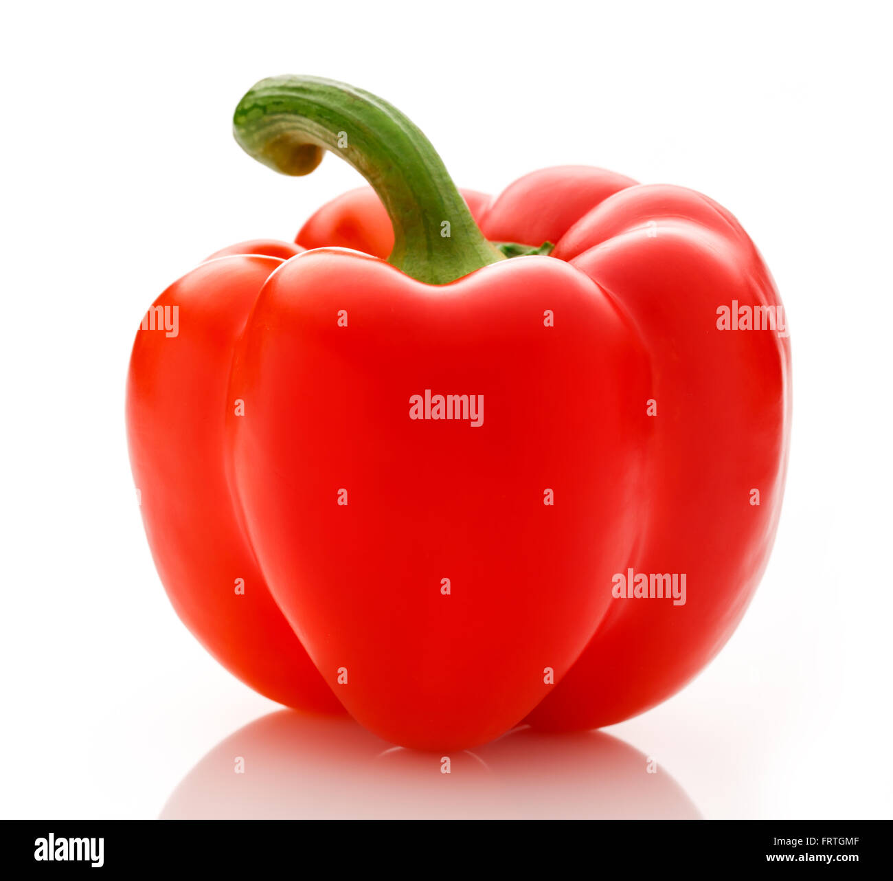 Single red paprika on the white background Stock Photo
