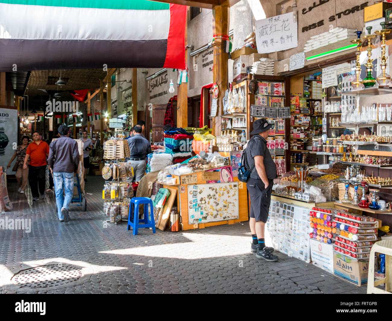 People shopping in the spice souk in the Deira district of Dubai, United Arab Emirates Stock Photo