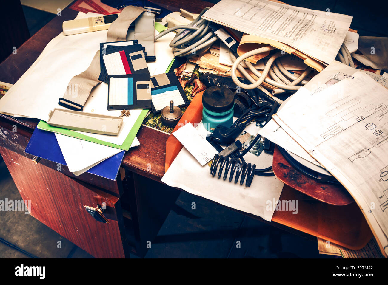 Messy workplace with stack of paper on table Stock Photo