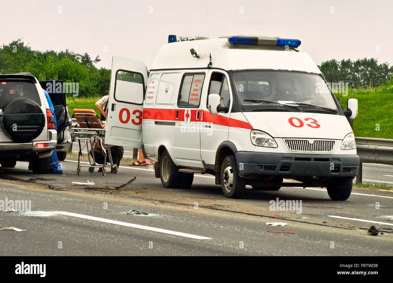 Emergency team working in road with car accident Stock Photo
