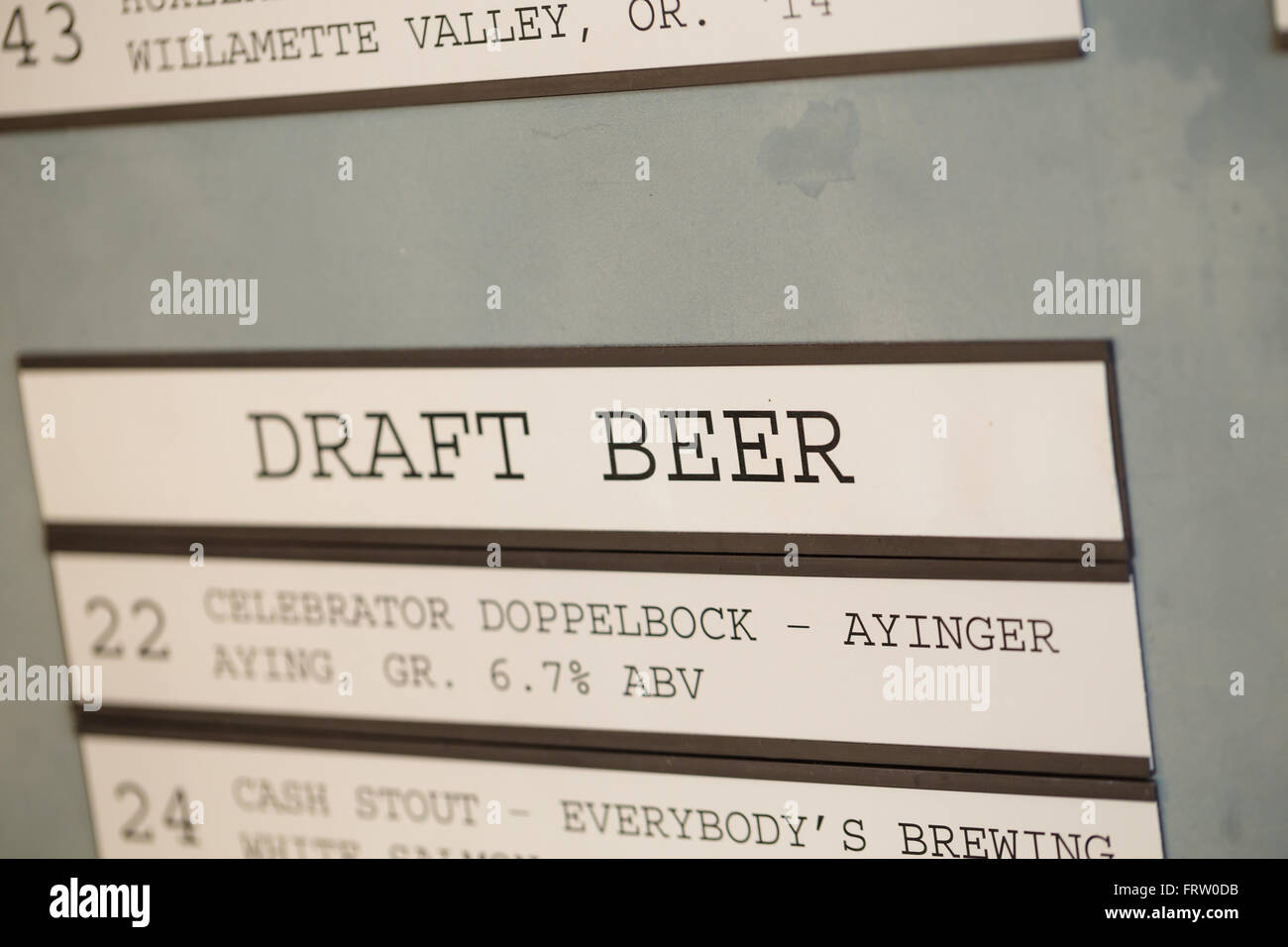 PORTLAND, OR - OCTOBER 24, 2015: Draft beer menu at Cooper's Hall a taphouse growler fill bar in Portland. Stock Photo