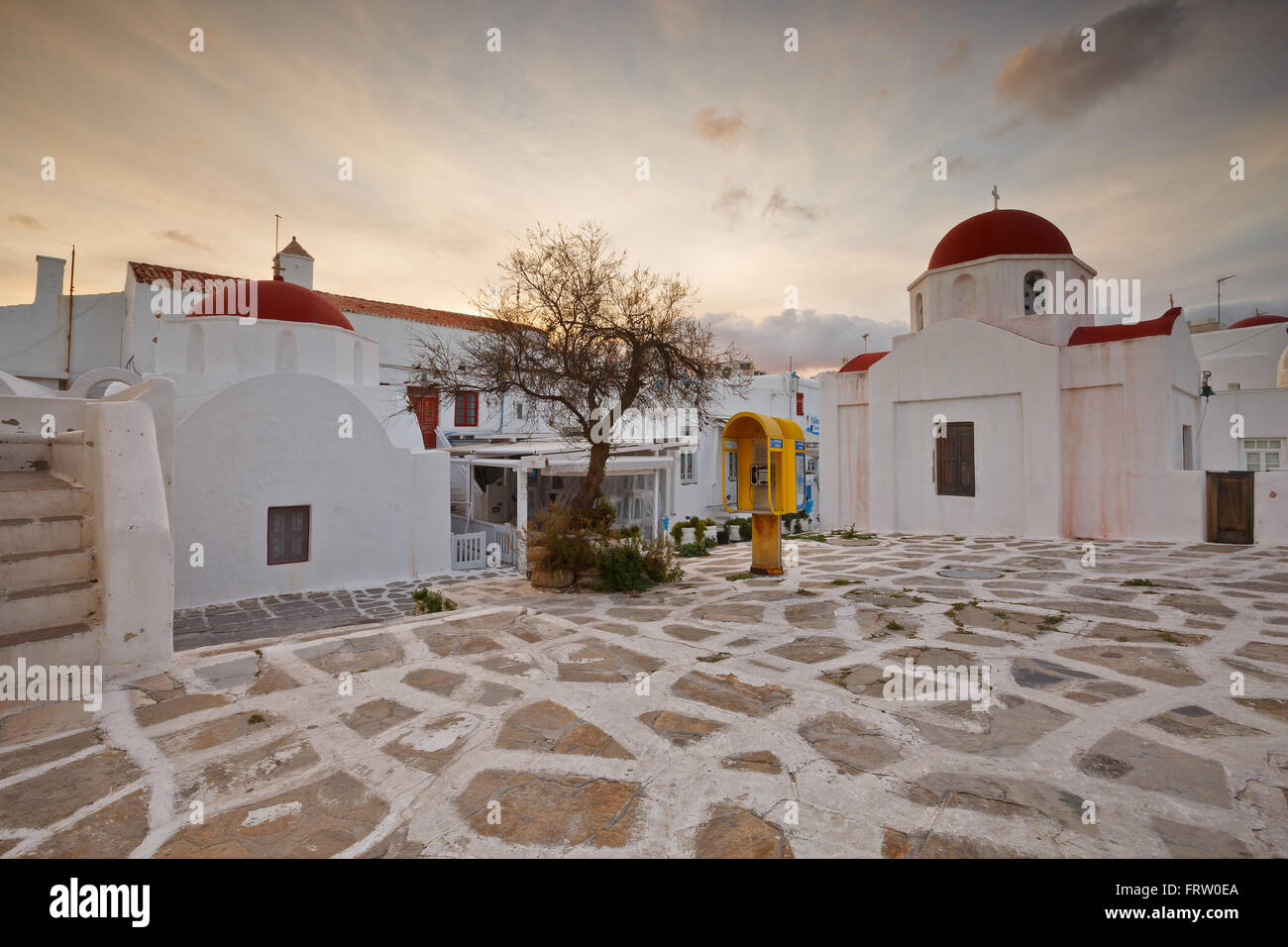 Small square in the town of mykonos with two byzantine churches stock photo alamy