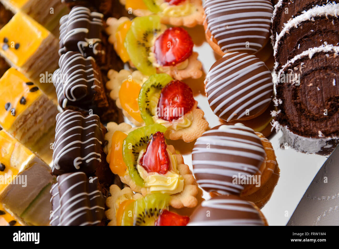 Different type of cakes on a plate and with side light Stock Photo
