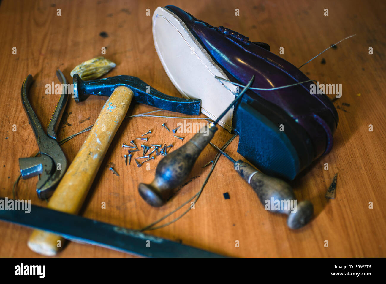 Shoemaker's tools and a new leather shoe Stock Photo Alamy