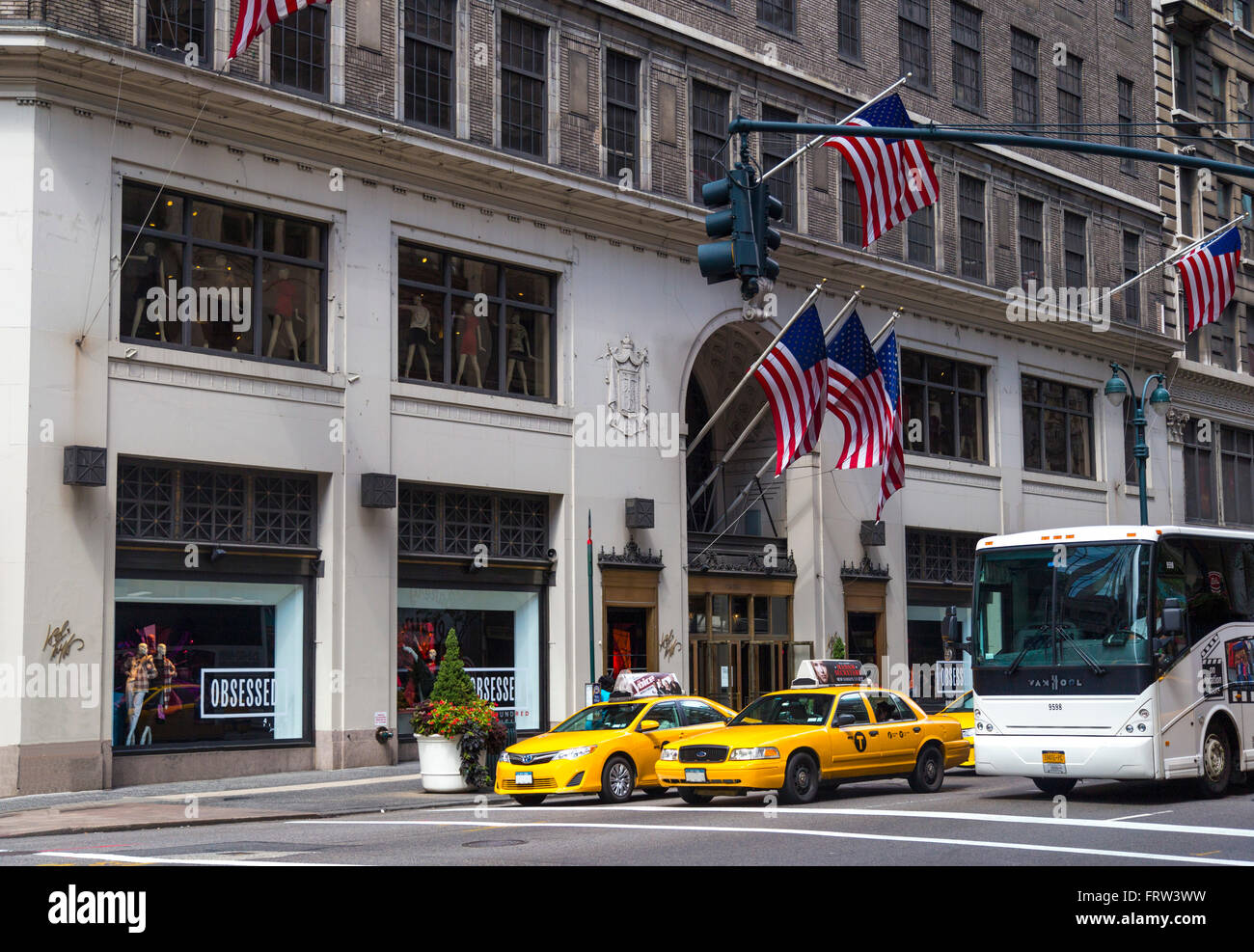 Traffic in New York City with famous yellow-coloured taxi cabs passing by Stock Photo