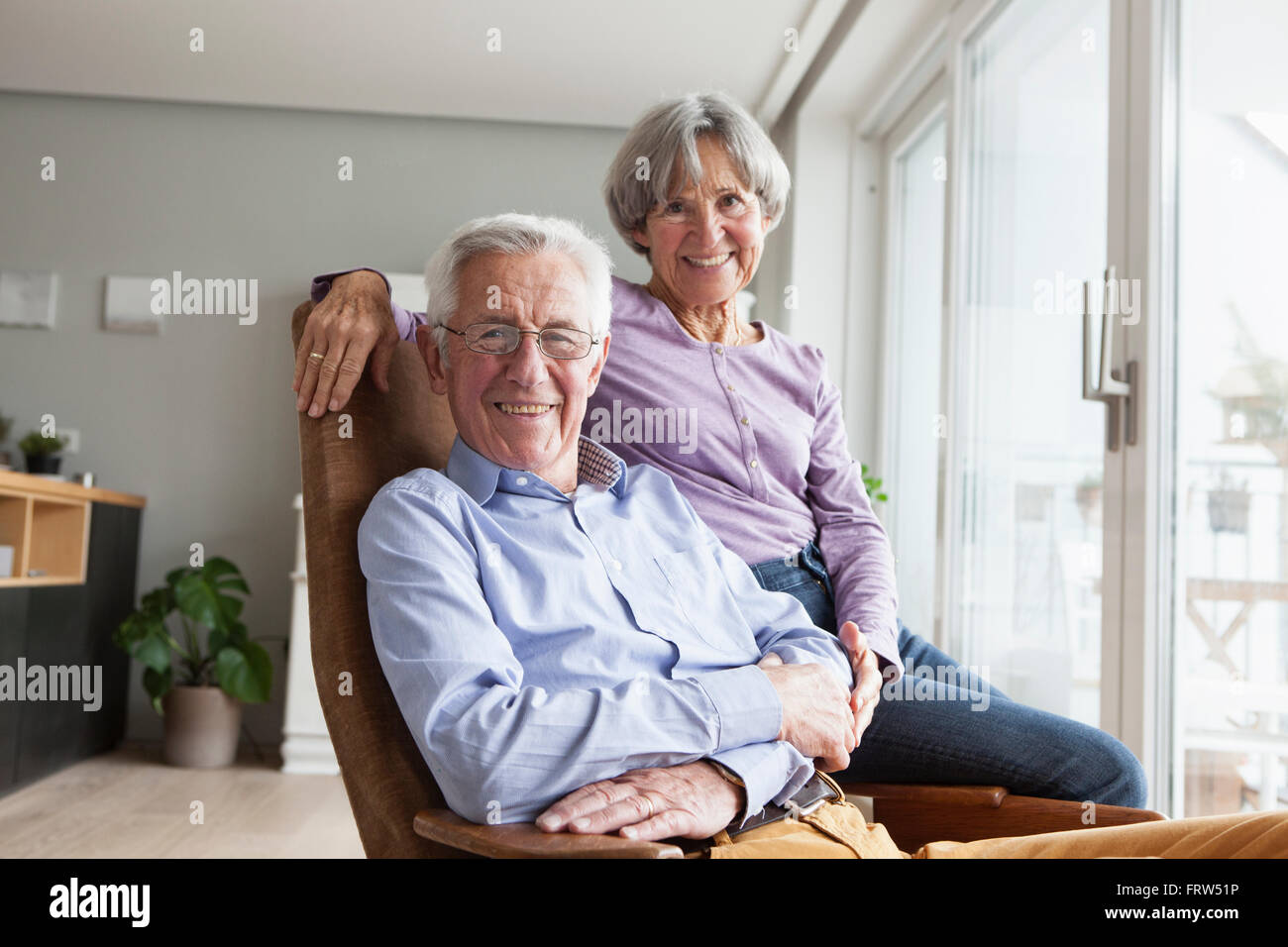 Happy senior couple at home Stock Photo - Alamy