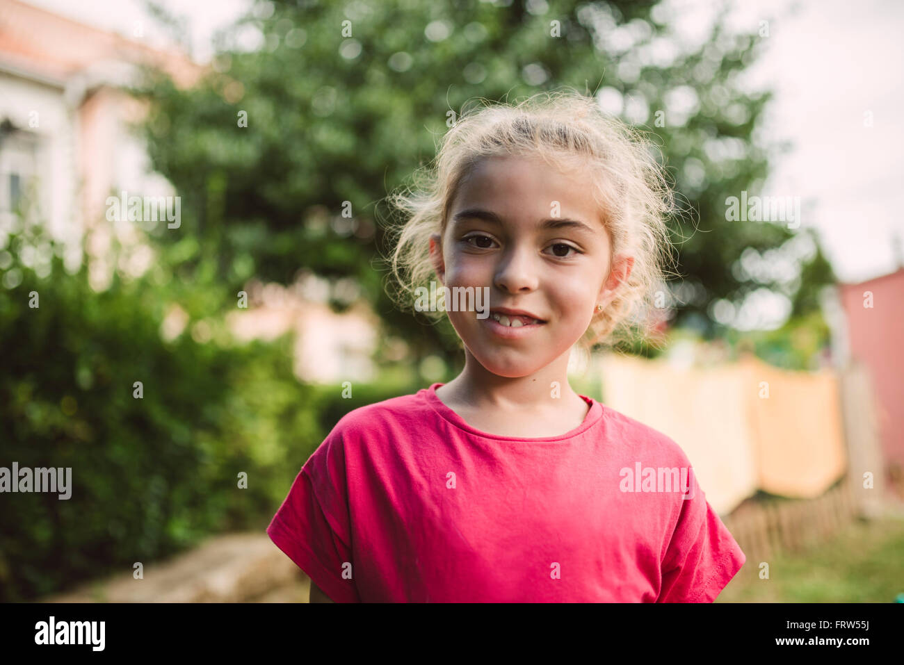 Portrait of smiling blond girl Stock Photo - Alamy
