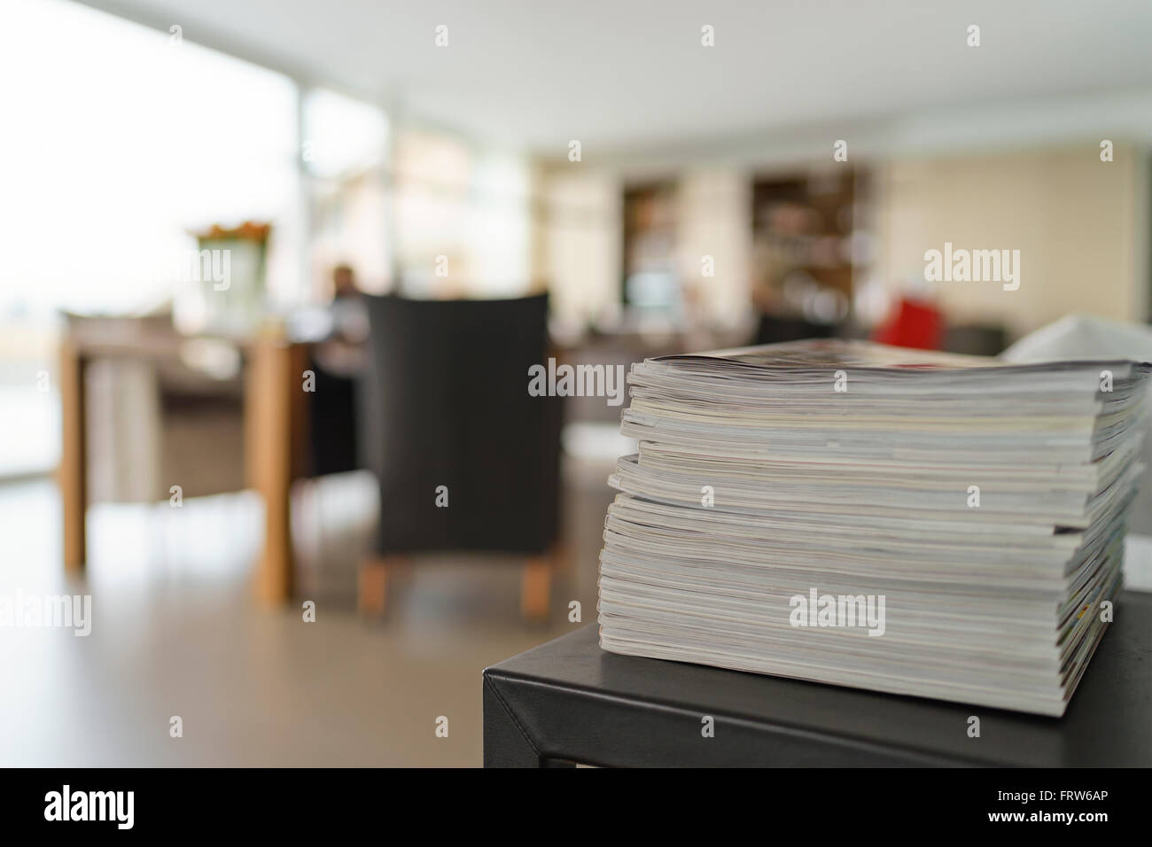 Stack of magazines in a modern living room Stock Photo - Alamy