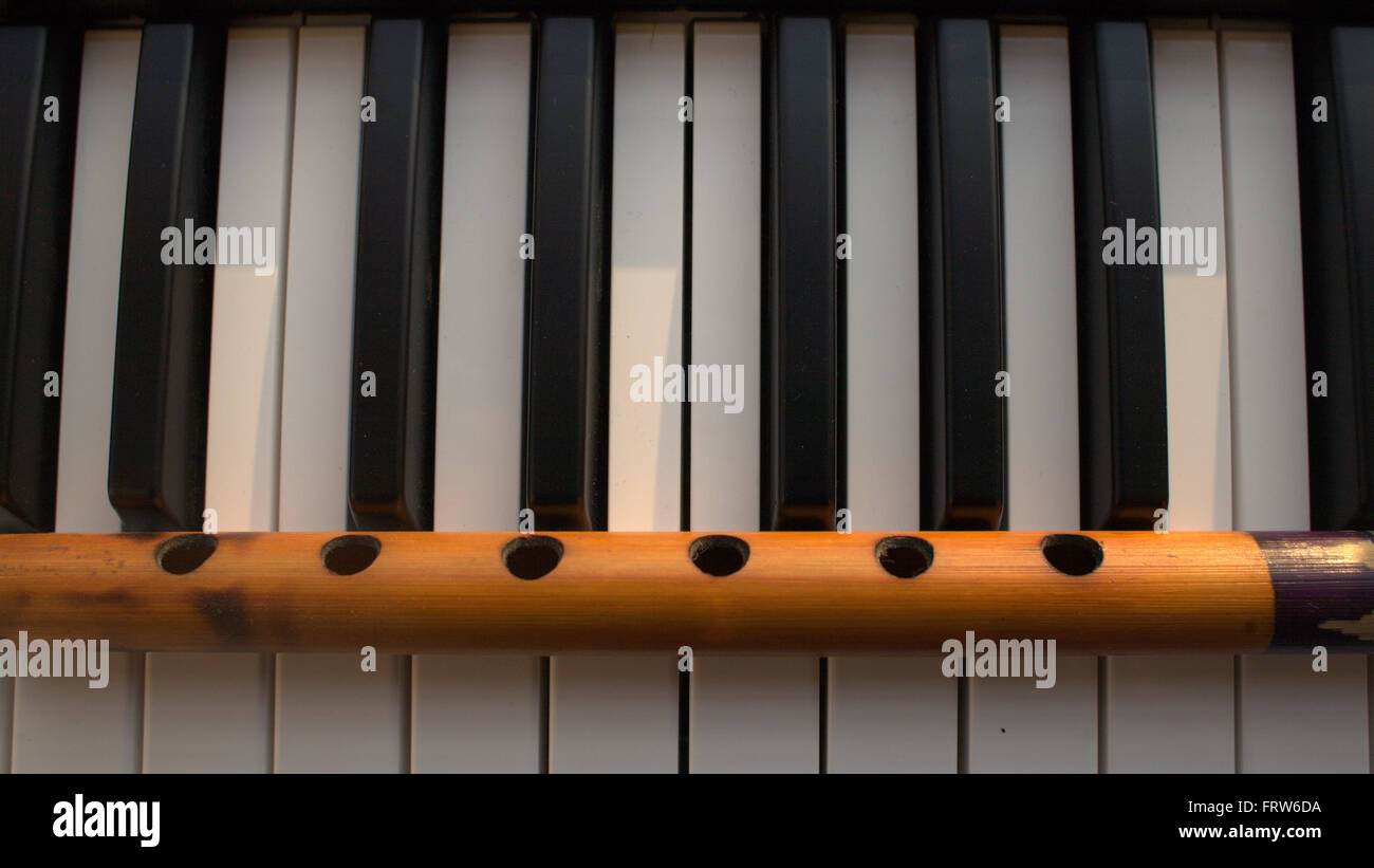 Musical scene with Piano Keyboard and Indian Indian Flute Stock Photo