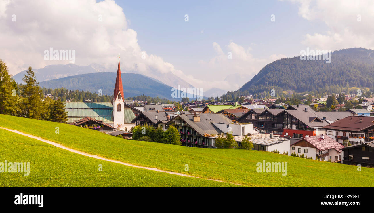 Austria, Tyrol, Seefeld in Tirol, townscape with parish church St. Oswald Stock Photo