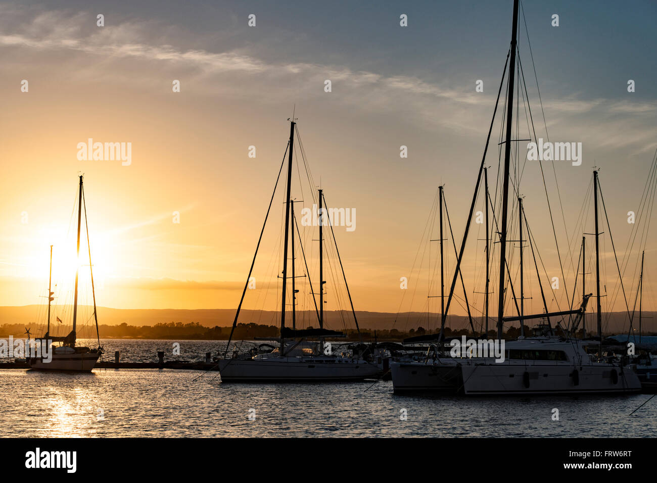 Italy, Sicily, Siracuse, boats at marina at sunset Stock Photo