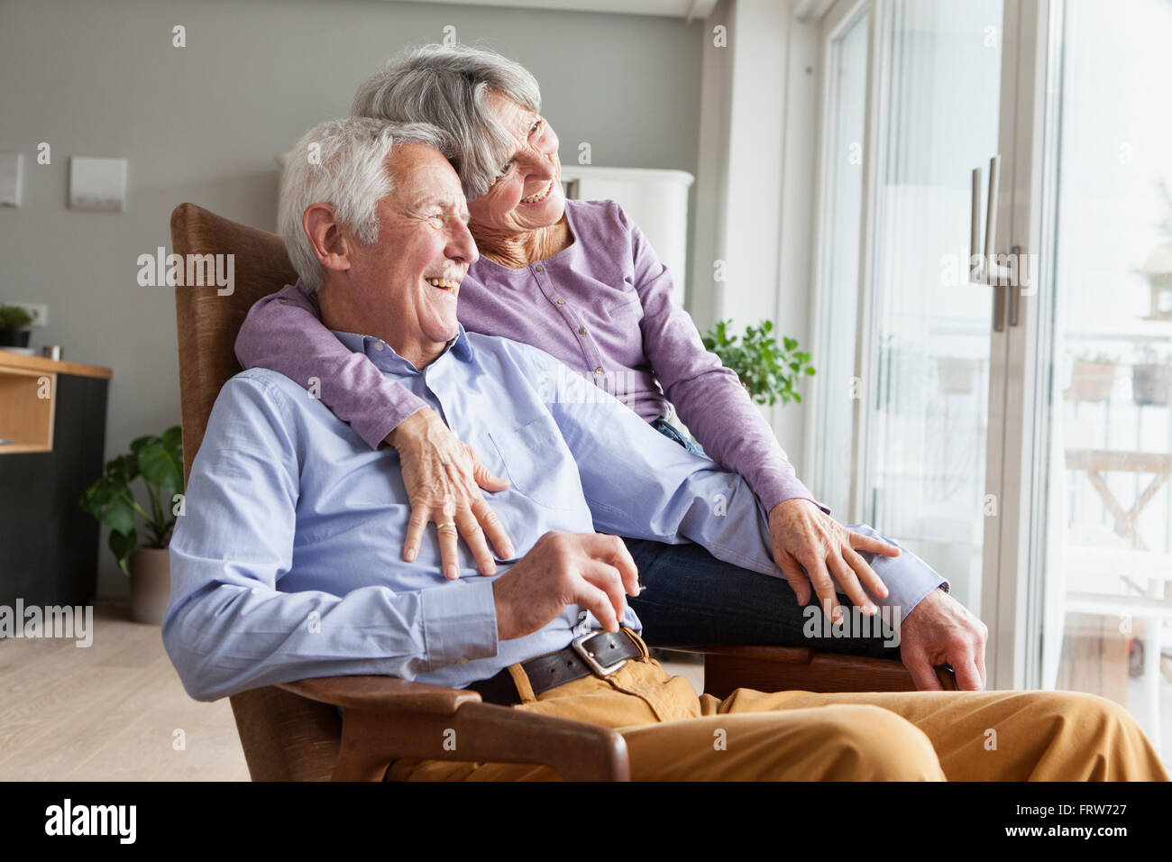 Happy senior couple at home Stock Photo - Alamy
