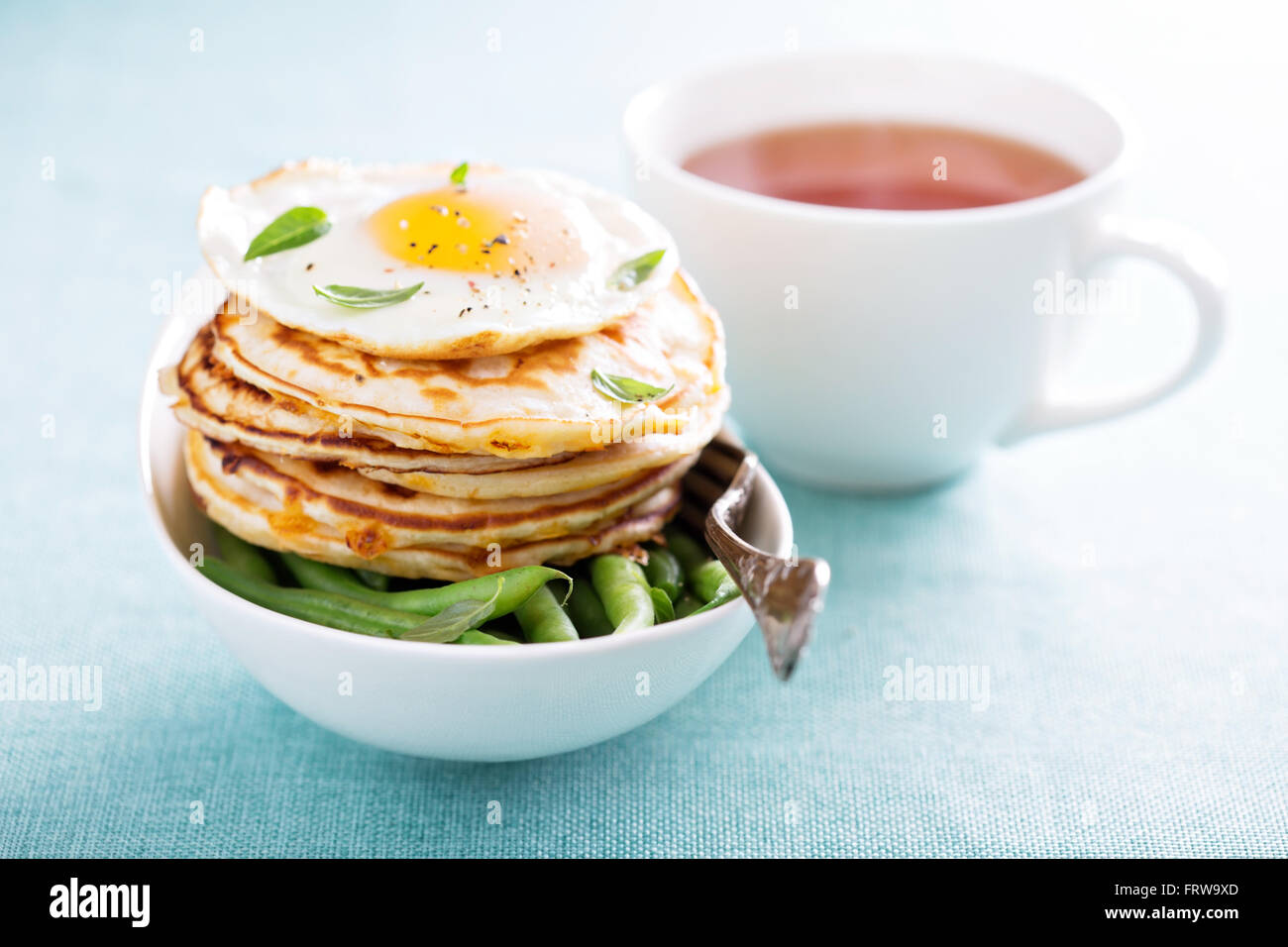 Cheese pancakes with green beans and egg Stock Photo Alamy