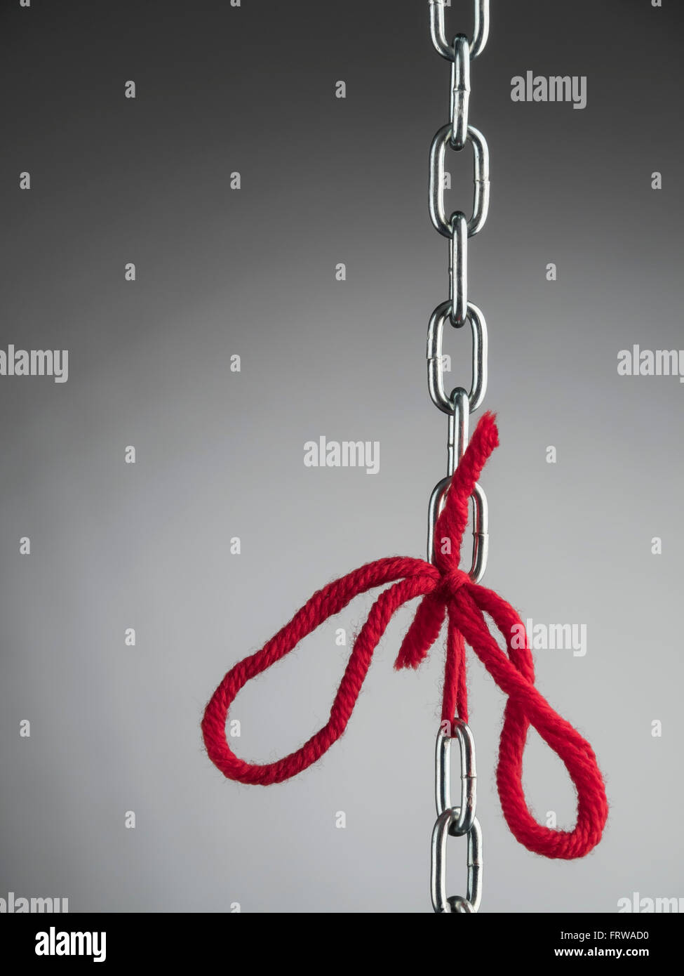 Chain and red ribbon, bonding Stock Photo