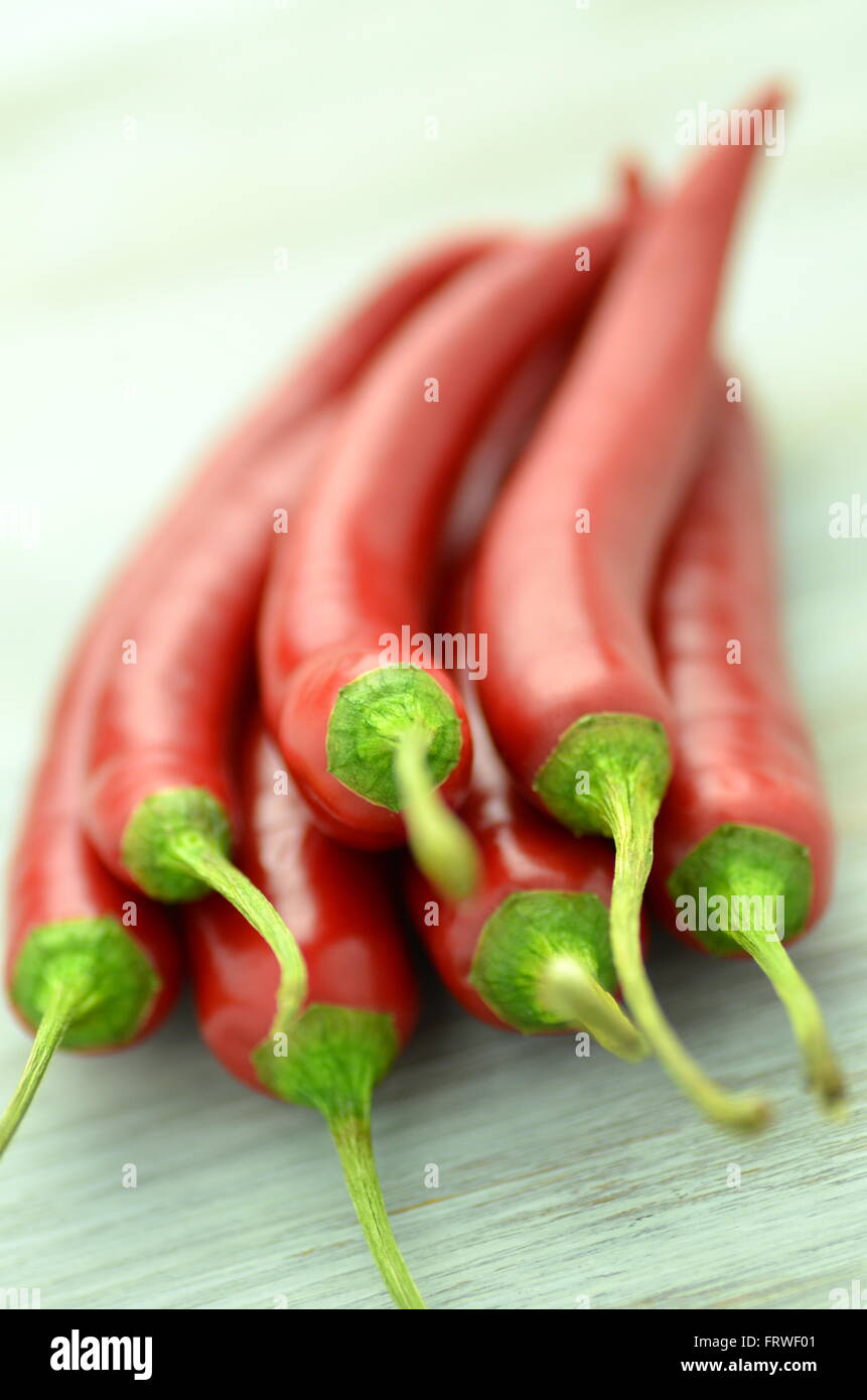 red hot chilli peppers on table Stock Photo - Alamy