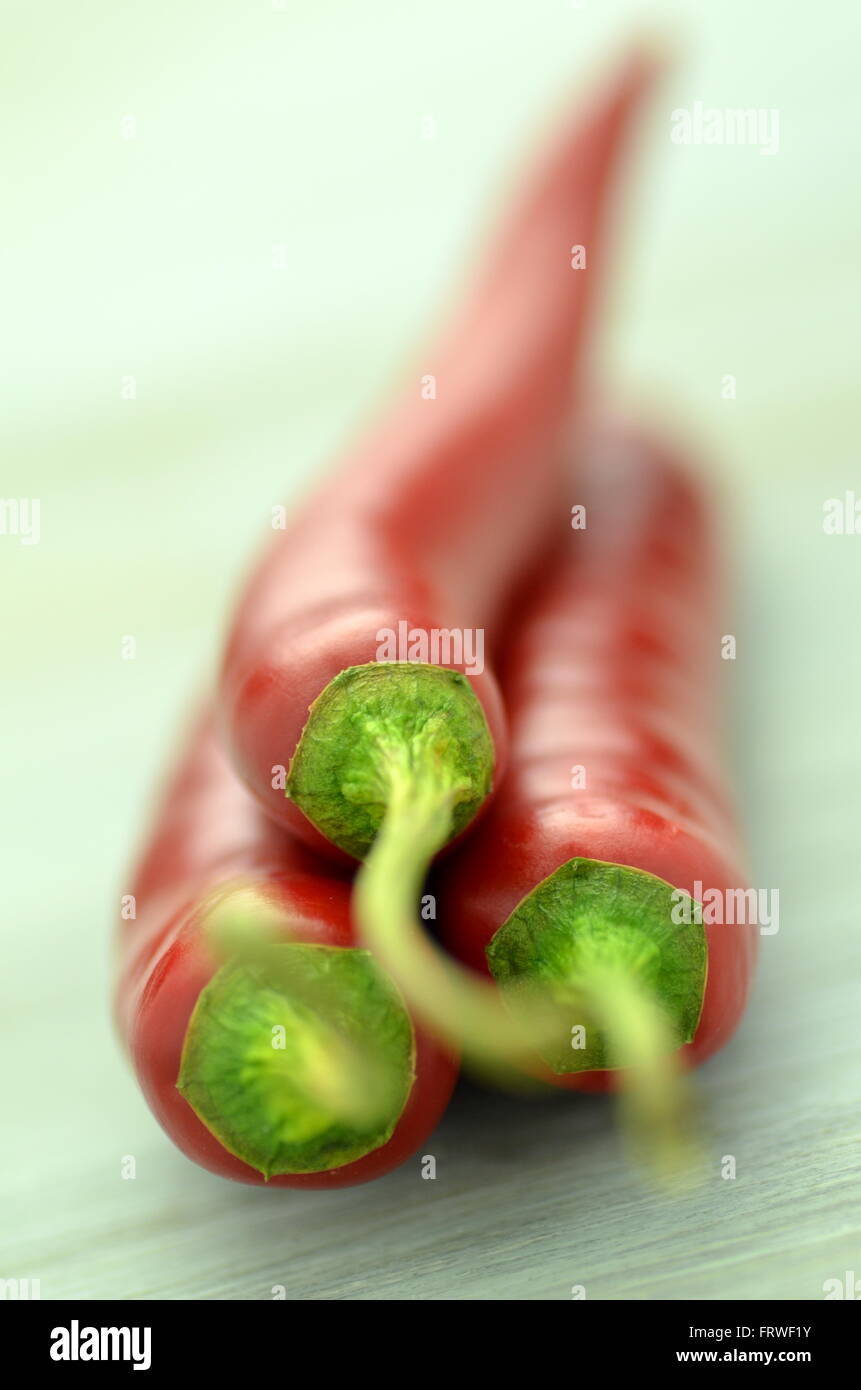 red hot chilli peppers on table Stock Photo - Alamy