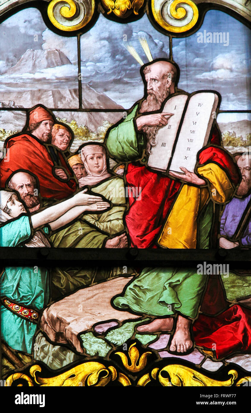 Stained glass window depicting Moses with the Stone Tablets in Saint James's Church in Stock Stock Photo