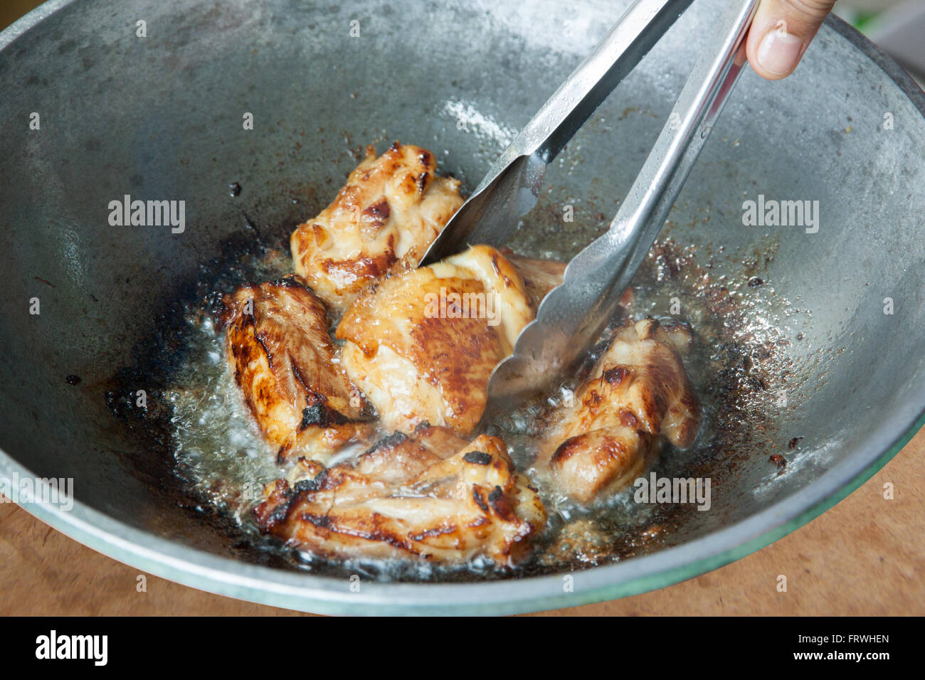 Fried Chicken Cooking in an Iron Skillet Stock Photo Alamy