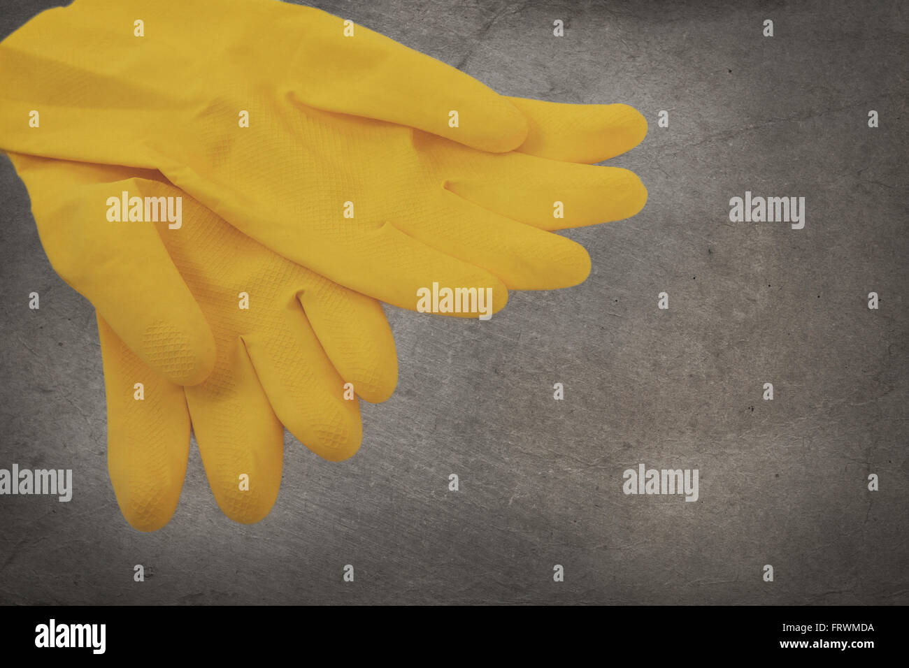 Vintage image - Yellow cleaning gloves, no person Stock Photo