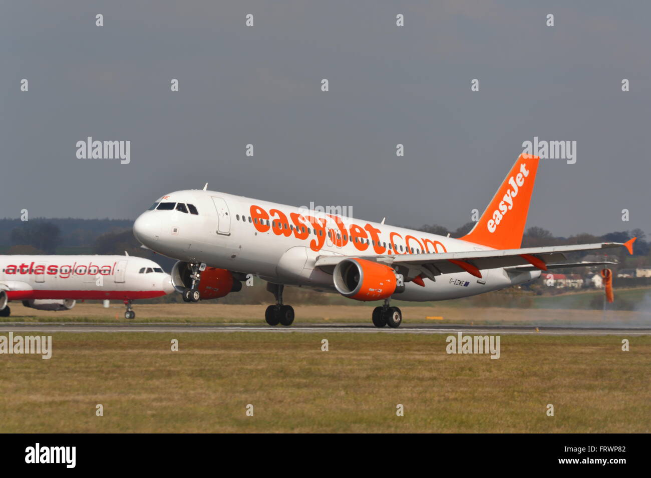 Lowcost airline Easyjet Airbus A320200 GEZWE landing at London Luton Airport, UK Stock Photo