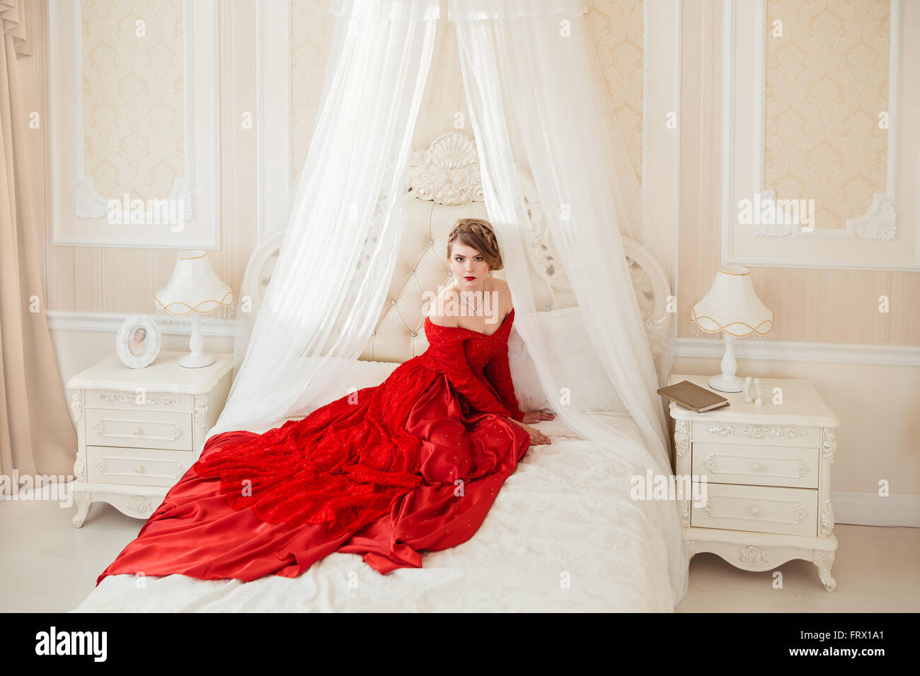 Beautiful woman in a red dress Stock Photo - Alamy