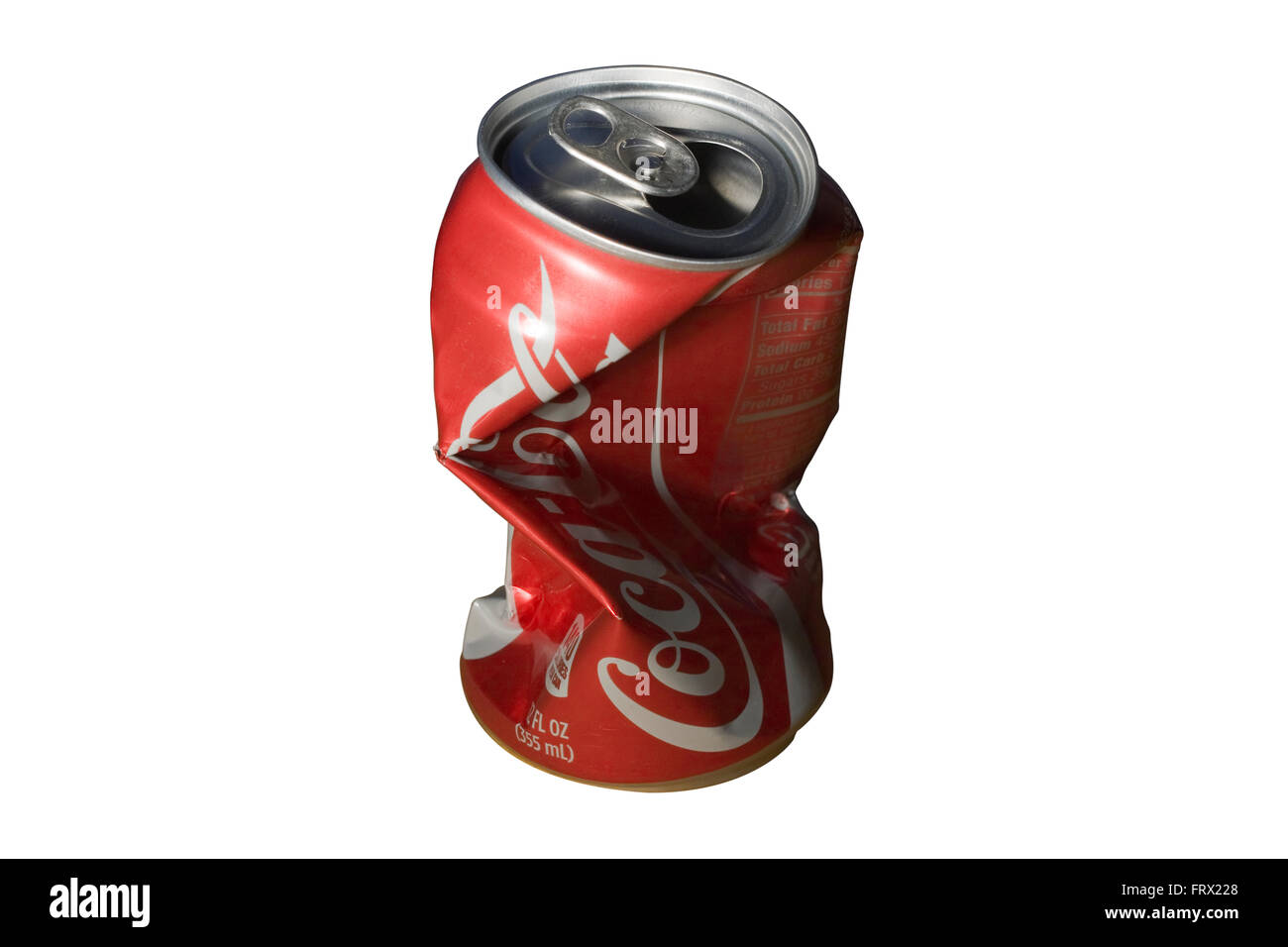 Cut Out Empty 12oz Coca-Cola can that has been crushed isolated on white background Stock Photo