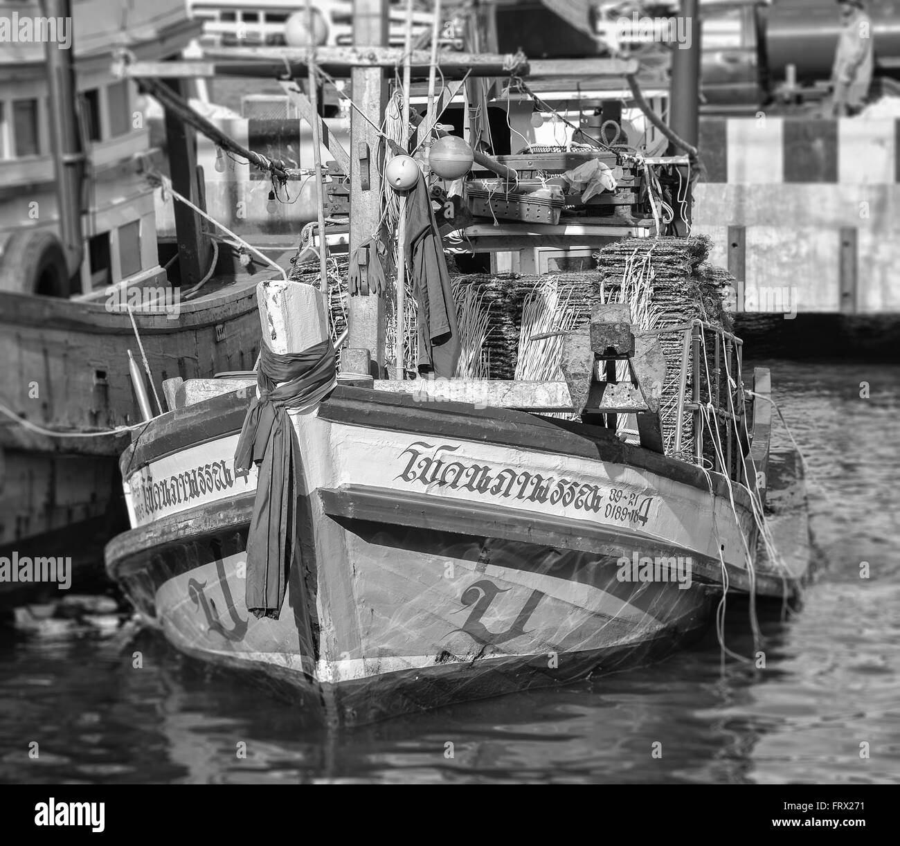 Local boat yard workers around the pier. Stock Photo