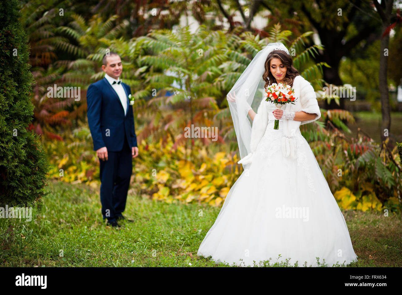 Happy wedding couple in love at autumn park Stock Photo - Alamy
