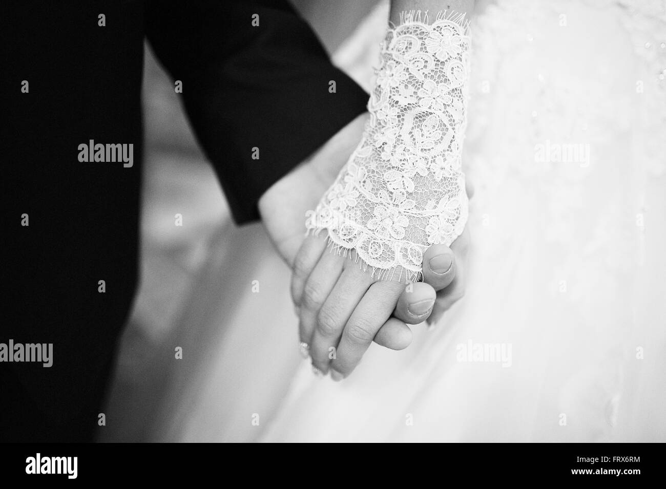Black and white photo of close up hands of wedding couple Stock Photo ...