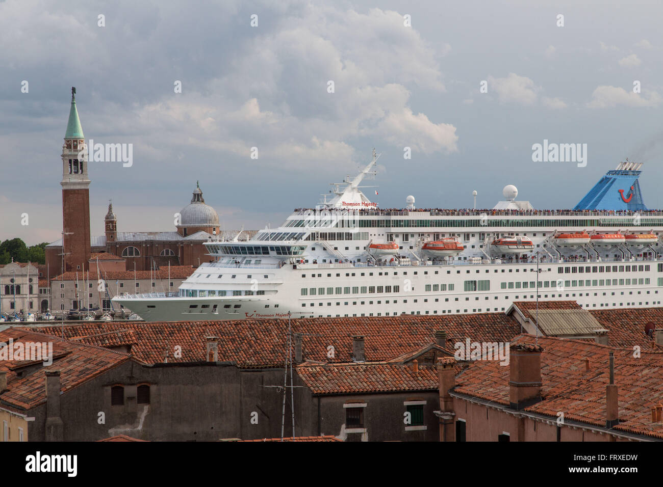 Cruise ship protest, Cruise ship towering above the roofs in the Giudecca Canal, Venice, Veneto, Italy Stock Photo