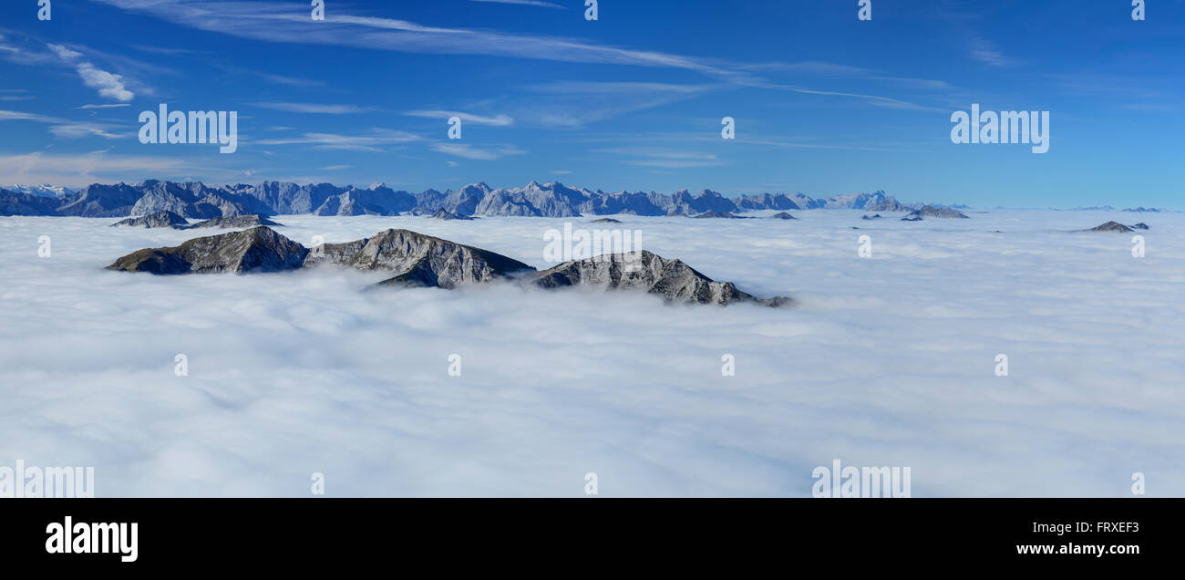Panorama from Guffert with view across a sea of fog with Stubai range, Unnuetz in foreground, Karwendel range and Wetterstein range with Zugspitze, Guffert, Rofan range, Tyrol, Austria Stock Photo