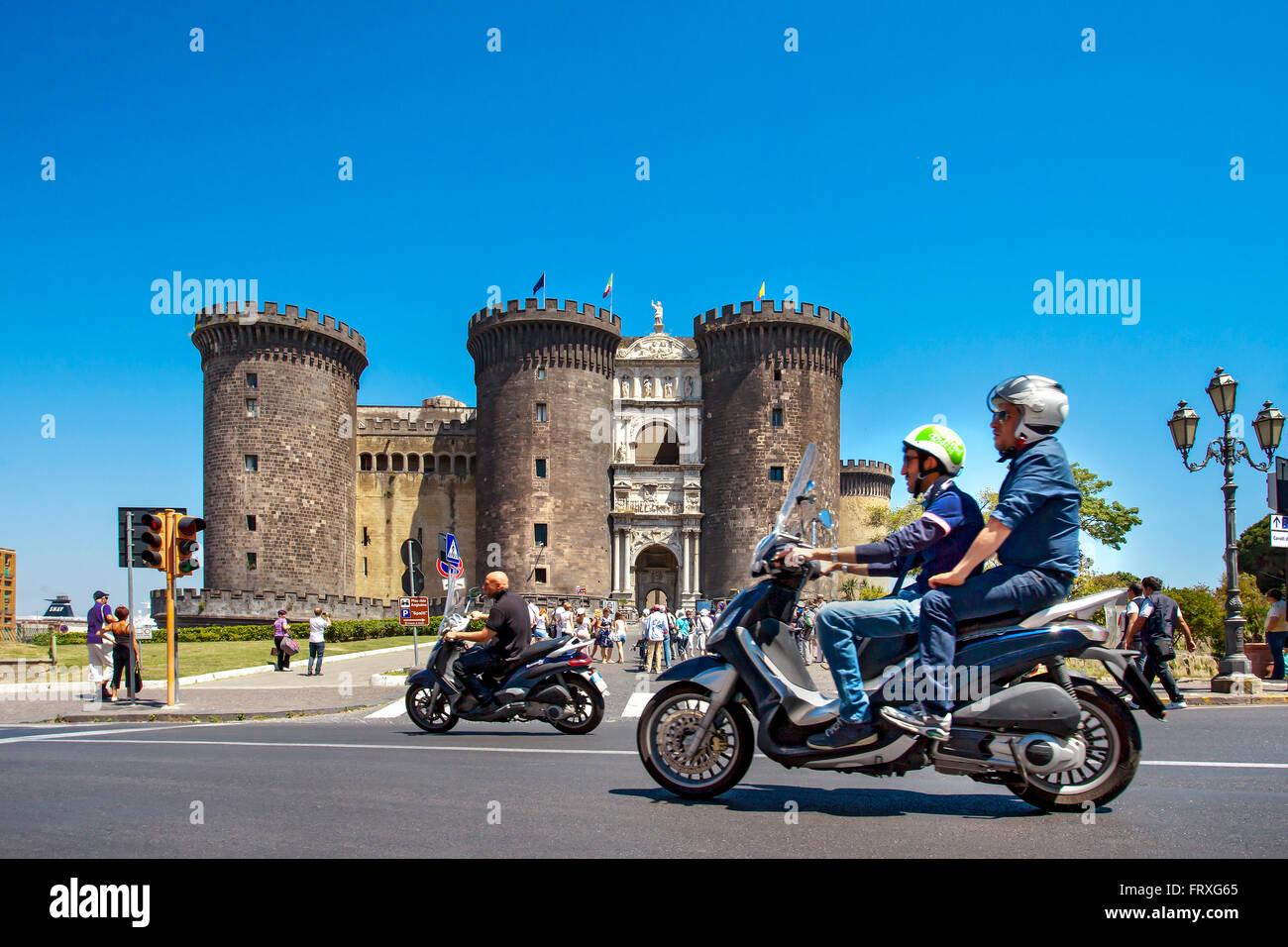 Scooters in front of Castel Nuovo, Naples, Bay of Naples, Campania, Italy Stock Photo