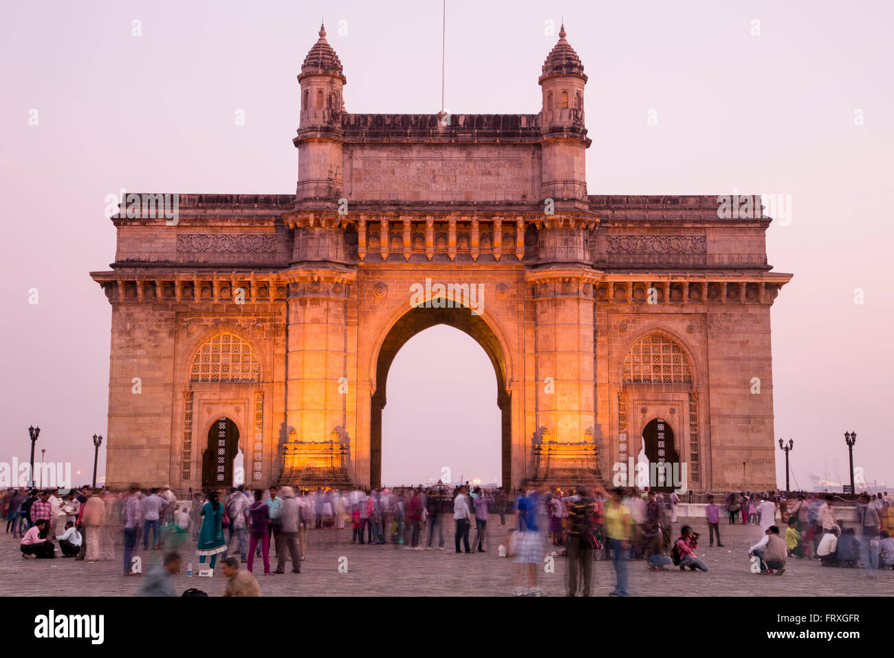 People in front of The Gateway to India at dusk, Mumbai, Maharashtra, India Stock Photo