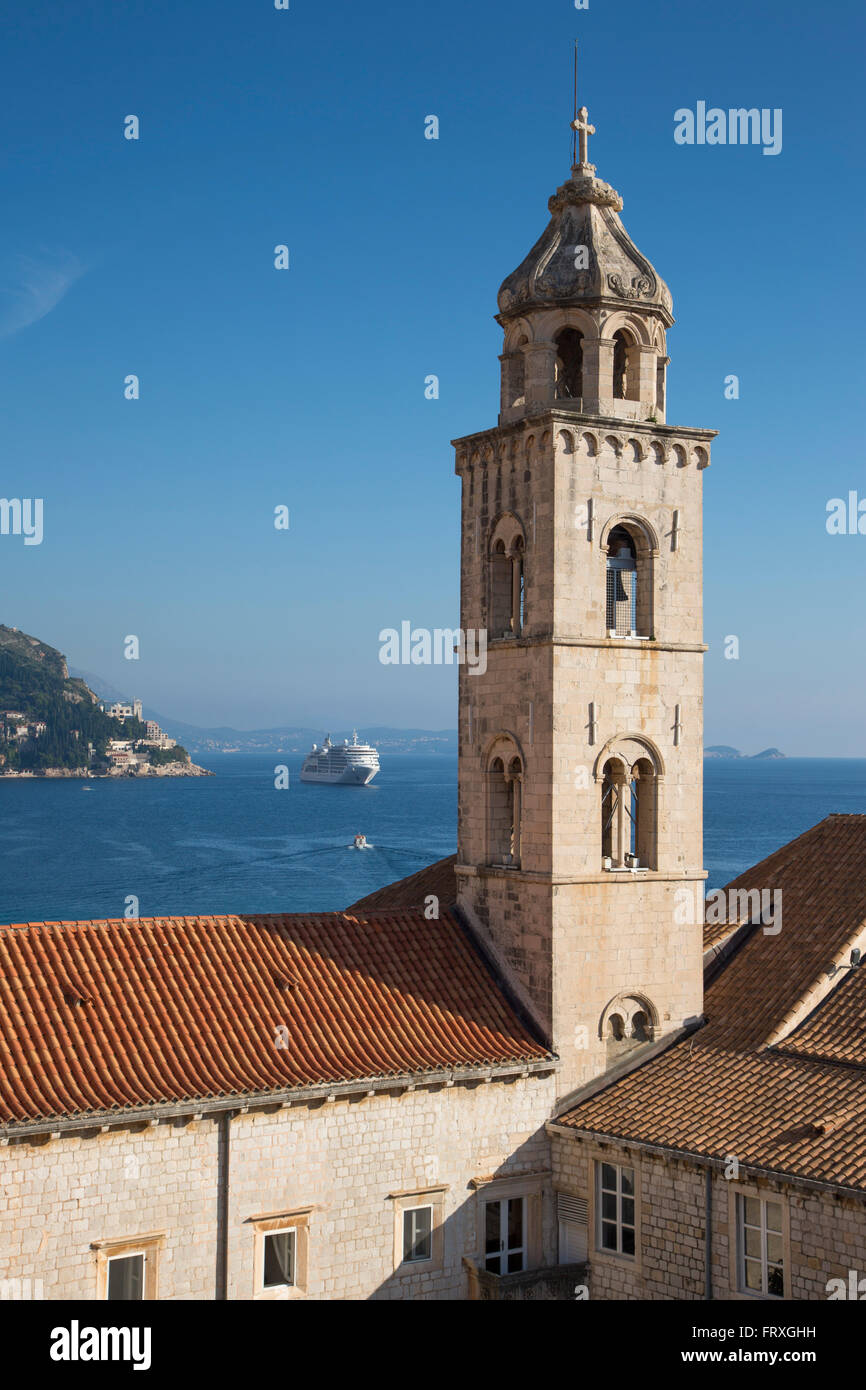 Church tower in the old town seen from city wall with cruise ship MV Silver Spirit in the distance, Dubrovnik, Dubrovnik-Neretva, Croatia Stock Photo